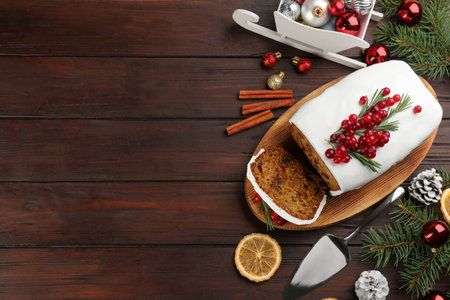 Flat lay composition with traditional classic Christmas cake on wooden table. Space for textの写真素材