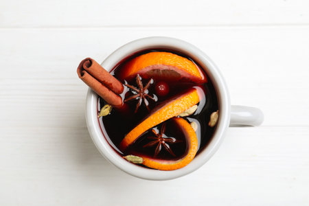 Aromatic mulled wine on white wooden table, top viewの写真素材