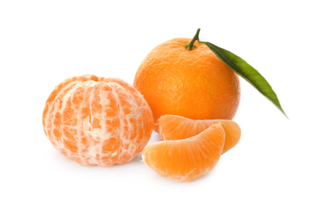 Fresh tangerines with green leaves on white backgroundの写真素材