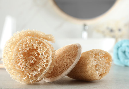 Natural loofah sponges on table in bathroom, closeupの写真素材
