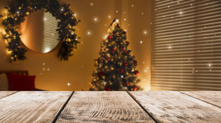 Empty wooden surface and blurred Christmas tree in room on background, bokeh effect. space for designの写真素材