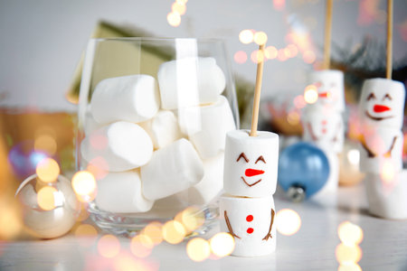 Funny snowman made of marshmallows on white table. bokeh effectの写真素材
