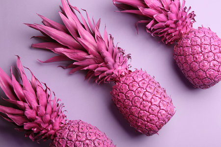 Pink pineapples on light background, flat lay. creative conceptの写真素材