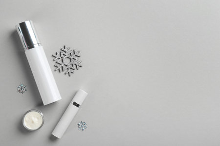 Flat lay composition with different cosmetic products on light gray background, space for text. winter careの写真素材