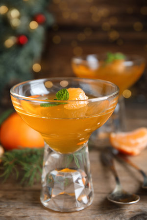 Delicious tangerine jelly on wooden table, closeupの写真素材
