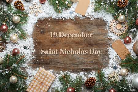 December 19 Saint Nicholas Day. Christmas decorations on wooden background, flat layの写真素材