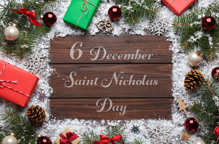 December 6 Saint Nicholas Day. Christmas decorations on wooden background, flat layの写真素材