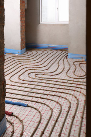 Installation of underfloor heating system in buildingの写真素材