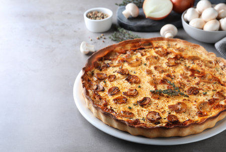 Delicious homemade mushroom pie on gray tableの写真素材