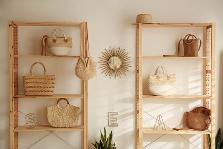 Stylish woman's bags on shelves in boutiqueの写真素材