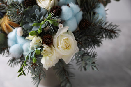 Beautiful wedding winter bouquet on light background, closeupの写真素材