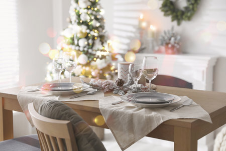 Festive table setting and beautiful Christmas decor in living room. interior designの写真素材