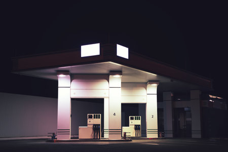 View of modern gas station at night outdoorsの写真素材