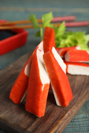 Fresh crab sticks served on wooden board, closeupの写真素材