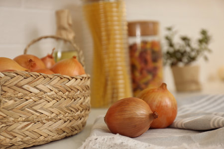 Fresh onions on countertop in modern kitchen, closeupの写真素材
