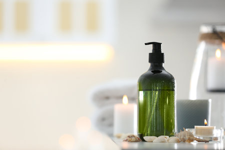 Soap dispenser and decor elements on table. Space for textの写真素材