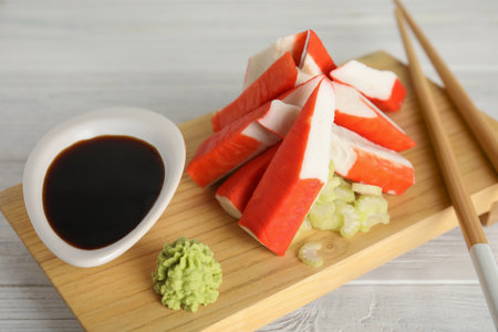 Cut crab sticks served on wooden table, closeupの写真素材