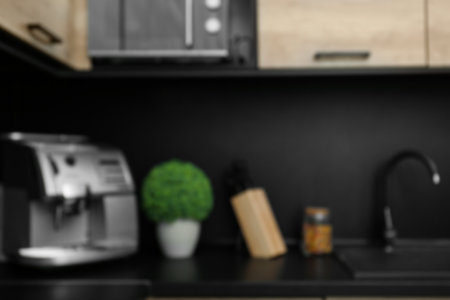 Blurred view of kitchen interior with modern furnitureの写真素材