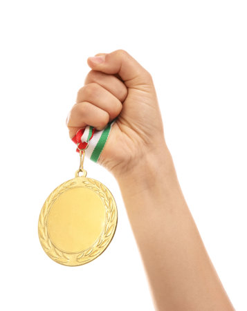 Woman holding gold medal on white background, closeupの写真素材
