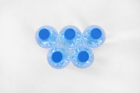 Plastic bottles with pure water on white background, top viewの写真素材