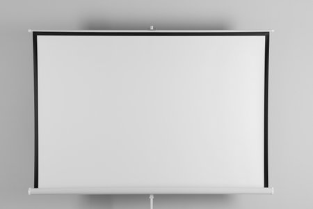Blank projection screen near white wall indoors. space for designの写真素材