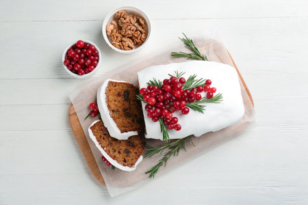 Traditional Christmas cake and ingredients on white wooden table, flat lay. classic recipeの写真素材