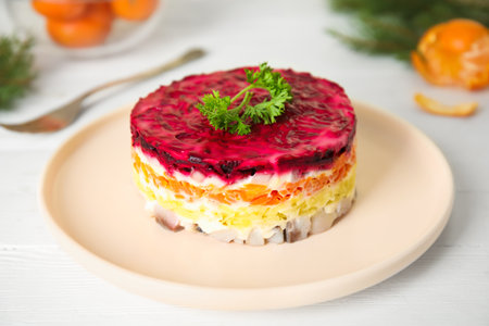 Herring under fur coat served on white wooden table. Russian traditional saladの写真素材
