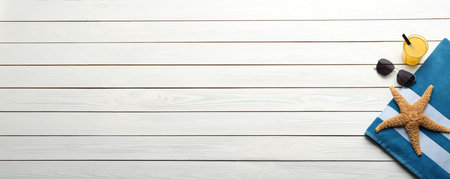 Beach accessories and space for text on white wooden background, flat lay. banner designの写真素材