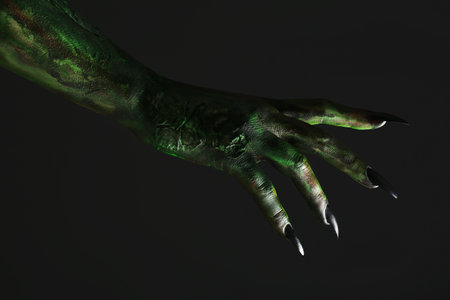 Scary monster on black background, closeup of hand. halloween characterの写真素材