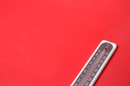 Weather thermometer on red background. Space for textの写真素材