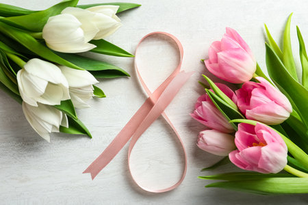 8 March greeting card design with tulips on white wooden table, flat layの写真素材
