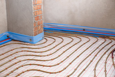 Installation of underfloor heating system in buildingの写真素材