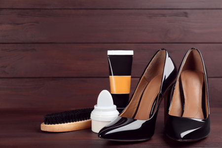 Shoes care accessories and footwear on brown wooden tableの写真素材