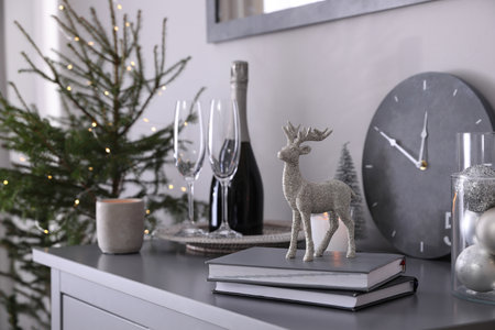 Christmas tree and decor on chest of drawers indoors. interior designの写真素材