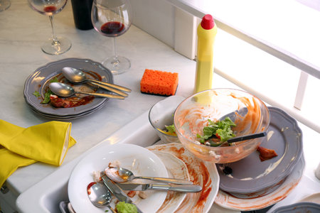 Dirty dishes in the kitchen after new year partyの写真素材