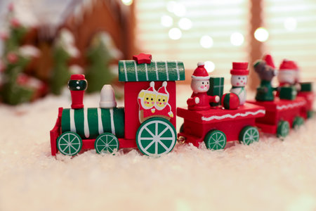 Decorative train toy on artificial snow, closeup. christmas atmosphereの写真素材
