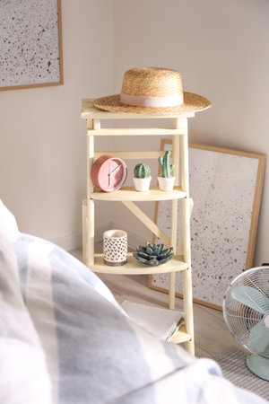 Decorative ladder with different stuff in stylish bedroom. Idea for interior designの写真素材