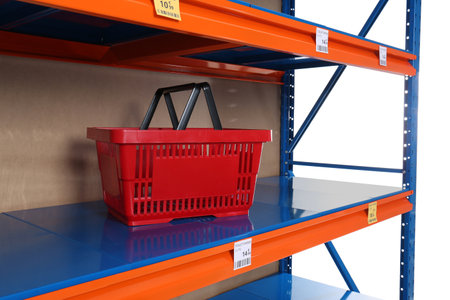 Almost empty shelves on white background. Product deficiency due to social panicの写真素材
