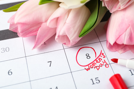 Tulips and red marker on calendar near date 8th of March, closeup. International Women's Dayの写真素材