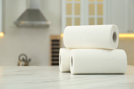 Paper towels on white marble table in kitchen, space for textの写真素材