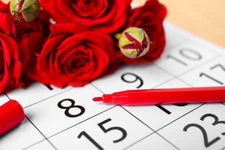 Roses and red marker on calendar near date 8th of March, closeup. International Women's Dayの写真素材