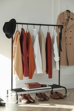 Rack with stylish clothes indoors. interior designの写真素材