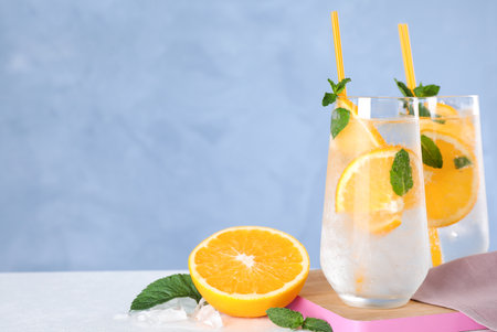 Delicious refreshing drink on white table. Space for textの写真素材