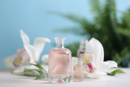 Beautiful spa composition with essential oil on white table, closeupの写真素材