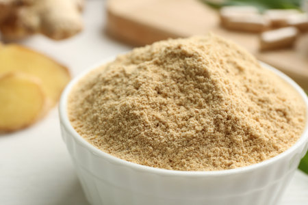 Dry powdered ginger in bowl, closeup viewの写真素材