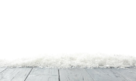 Snow on gray wooden surface against white background. christmas seasonの写真素材