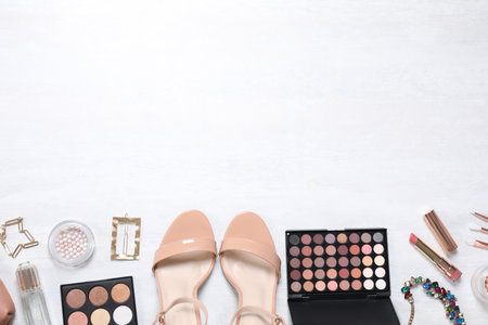 Cosmetic products and accessories on white background, flat lay. Space for textの写真素材