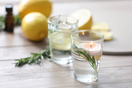 Natural homemade mosquito repellent candle on wooden table. Space for textの写真素材