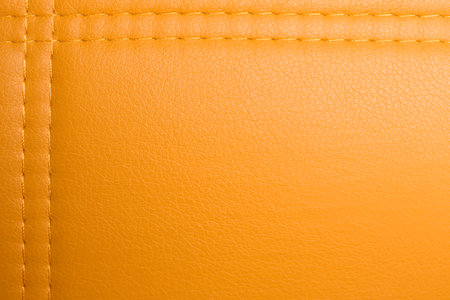 Texture of orange leather as background, top viewの写真素材