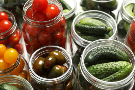 Pickling jars with fresh vegetables, closeup viewの写真素材